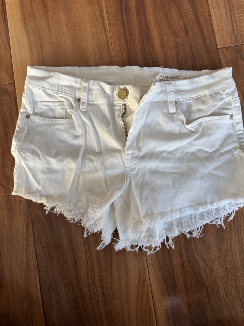 Blank NYC Distressed White Denim Cutoff Shorts